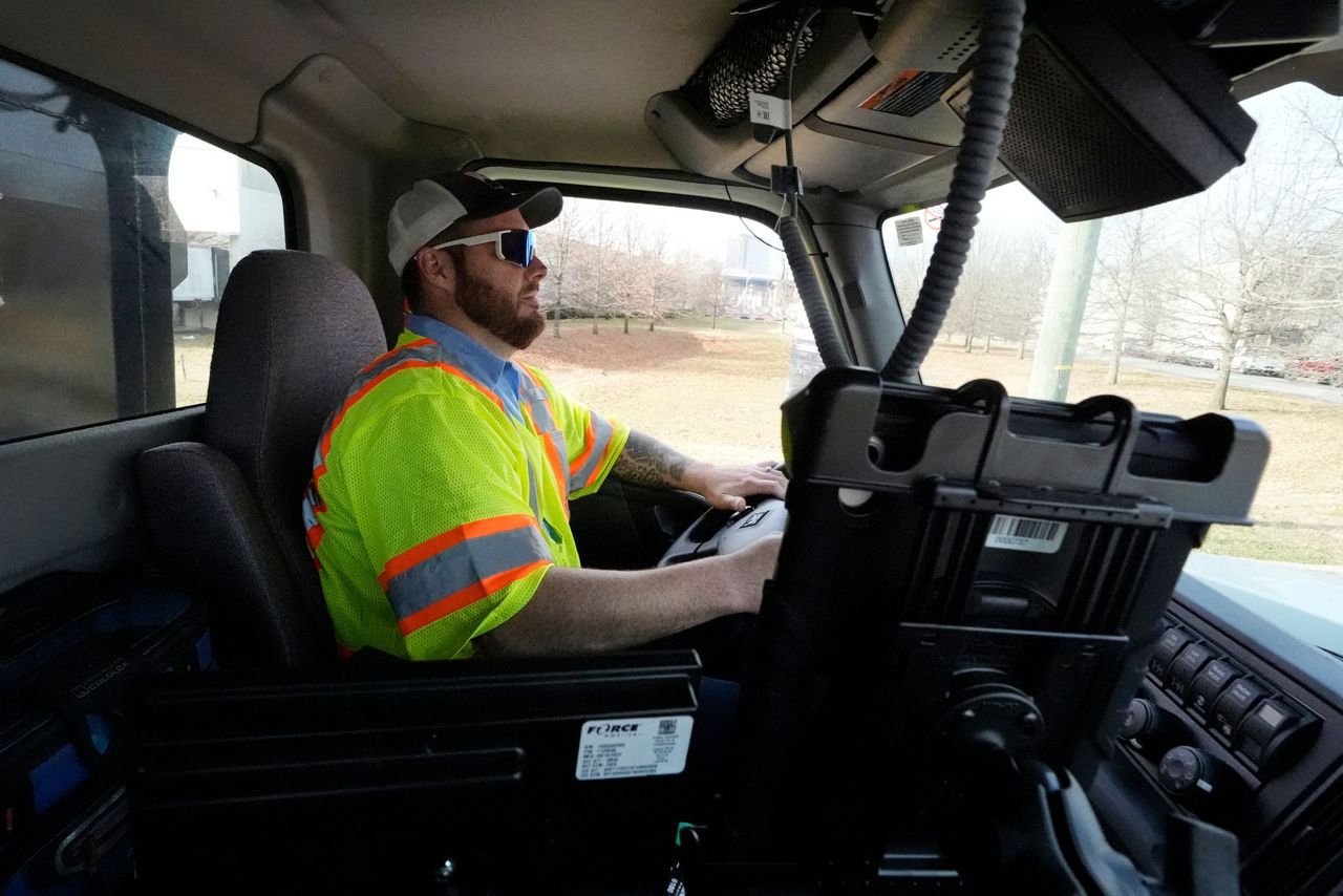 Crews spread salt on roads and people stock up on batteries as a winter ...