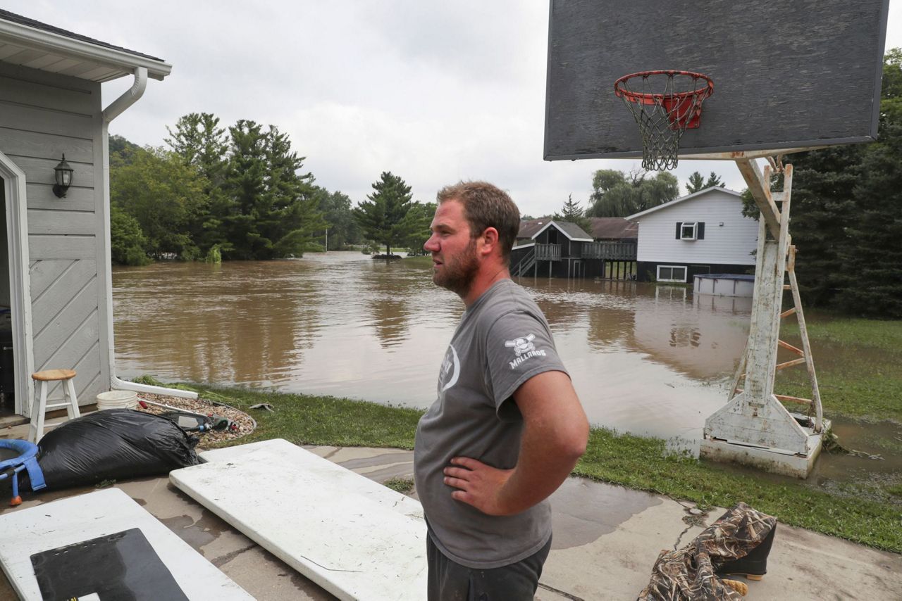 Crews search for man swept away in Wisconsin flooding