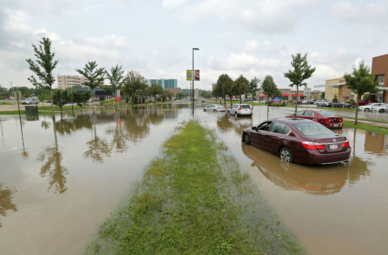 Crews search for man swept away in Wisconsin flooding
