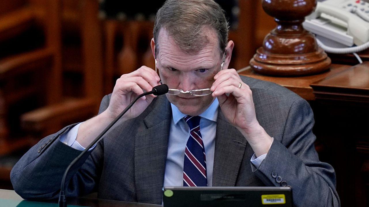 Witness Jeff Mateer reviews a document during the impeachment trial for Texas Attorney General Ken Paxton in the Senate Chamber at the Texas Capitol, Wednesday, Sept. 6, 2023, in Austin, Texas. (AP Photo/Eric Gay)