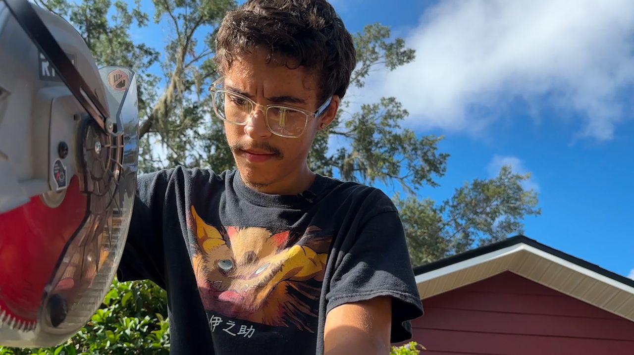 Anthony Byrne, 18, is in his second month on the job as an assistant technician at the Osceola Council on Aging. (Spectrum News 13/Maria Serrano)