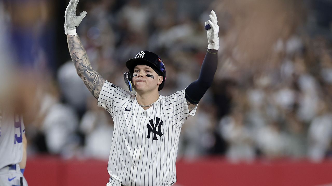 New York Yankees' Alex Verdugo reacts after driving in a run on a double against the Kansas City Royals during the seventh inning of Game 1 of the American League baseball division series, Saturday, Oct. 5, 2024, in New York. (AP Photo/Adam Hunger)