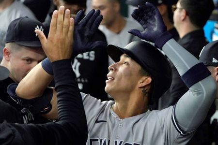 New York Yankees closing pitcher Jonathan Loaisiga throws during the ninth  inning in the first baseball game of a doubleheader against the Texas  Rangers in Arlington, Texas, Tuesday, Oct. 4, 2022. The Yankees won 5-4.  (AP Photo/LM Otero Stock Photo