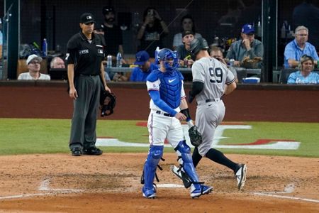 New York Yankees closing pitcher Jonathan Loaisiga throws during the ninth  inning in the first baseball game of a doubleheader against the Texas  Rangers in Arlington, Texas, Tuesday, Oct. 4, 2022. The Yankees won 5-4.  (AP Photo/LM Otero Stock Photo