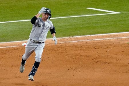 New York Yankees' Kyle Higashioka rounds the bases after hitting a