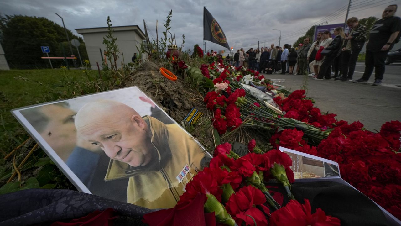 A portrait of the owner of private military company Wagner Group, Yevgeny Prigozhin, lays Thursday at an informal memorial next to the former PMC Wagner Centre in St. Petersburg, Russia. (AP Photo/Dmitri Lovetsky)
