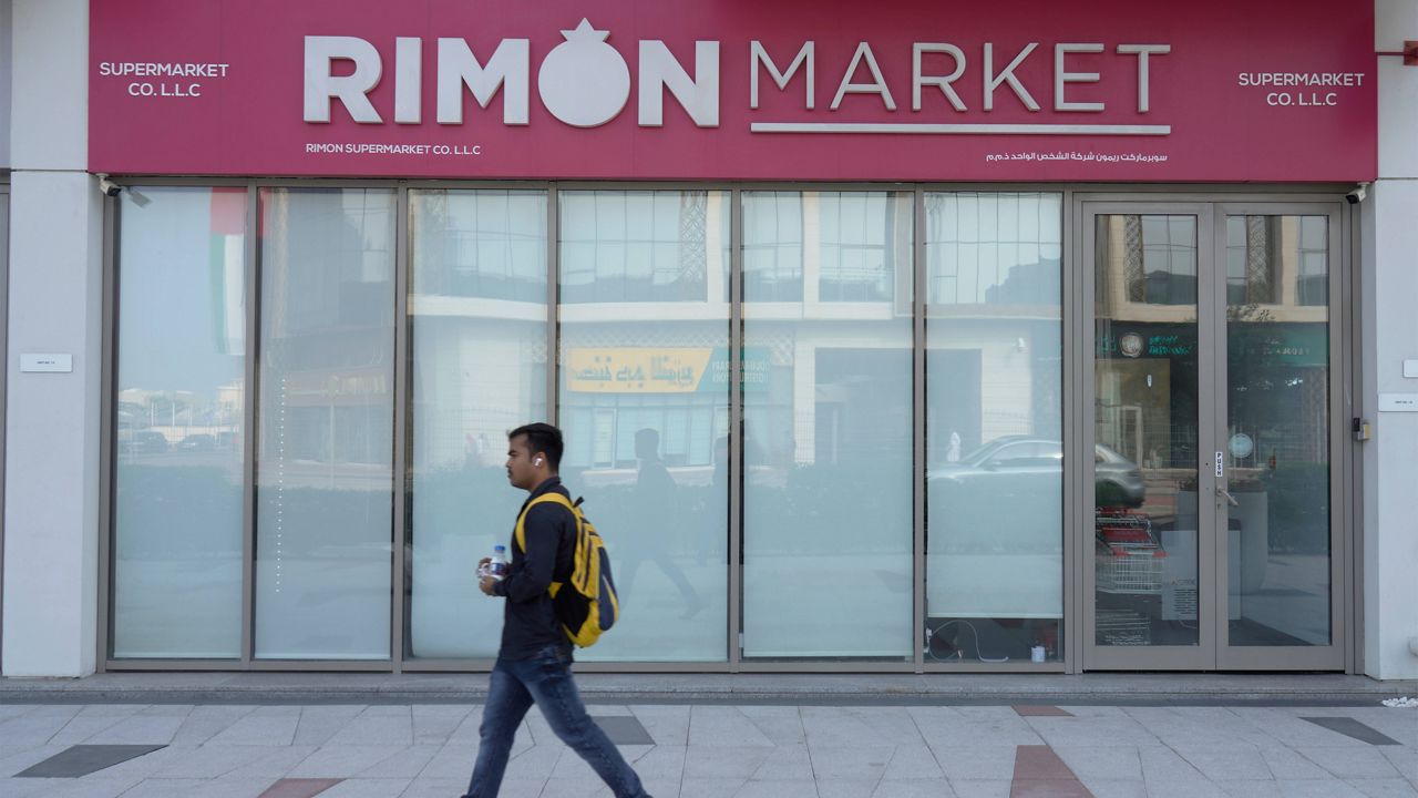 A man walks past Rimon Market, a Kosher grocery store managed by the late Rabbi Zvi Kogan, in Dubai, United Arab Emirates, Sunday, Nov. 24, 2024. (AP Photo/Jon Gambrell)