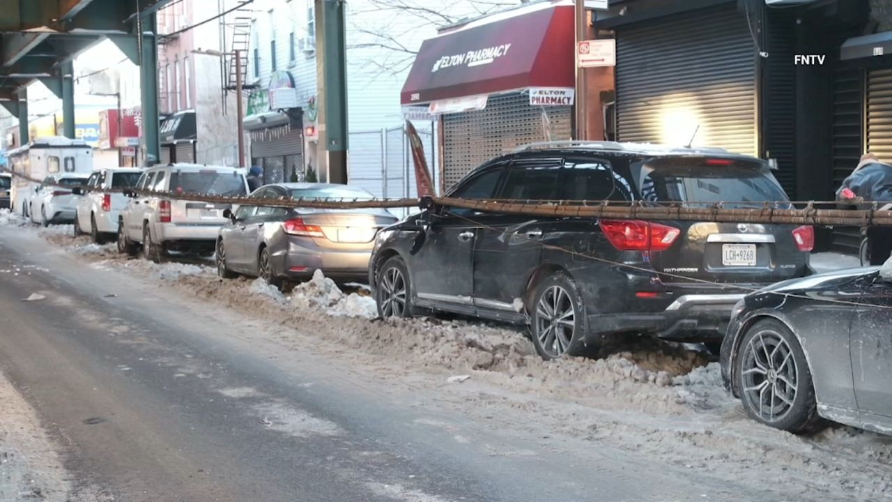 Cable falls from train track onto cars in Brooklyn