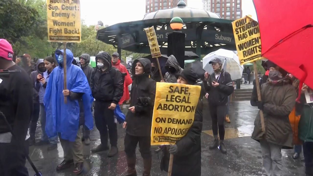 Abortion rights rally draws hundreds in the rain and cold
