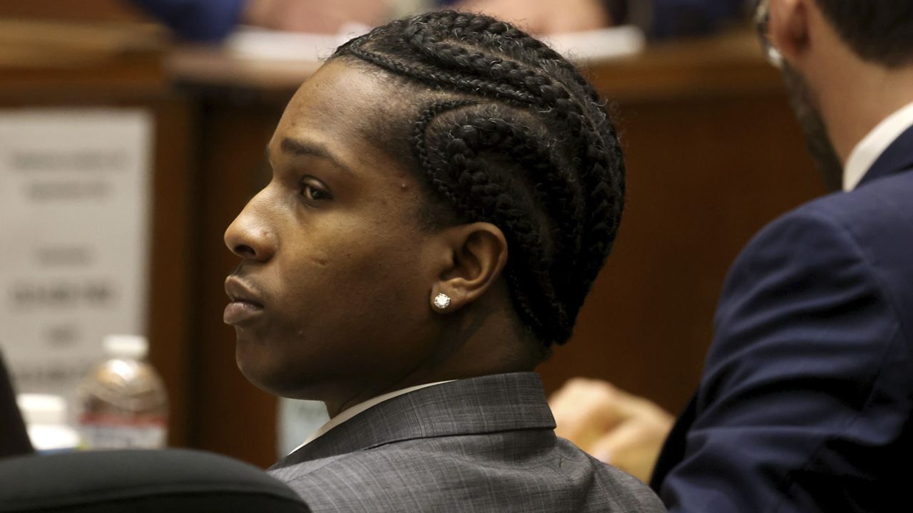 Rakim Mayers, aka A$AP Rocky, and his attorney Joe Tacopina listen to opening remarks by the prosecuting attorney in Mayers' trial at the Clara Shortridge Foltz Criminal Justice Center in downtown Los Angeles on Friday. (Genaro Molina/Los Angeles Times via AP)