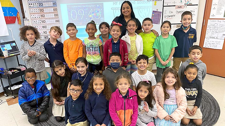 First-grade teacher helps students learn a 2nd language