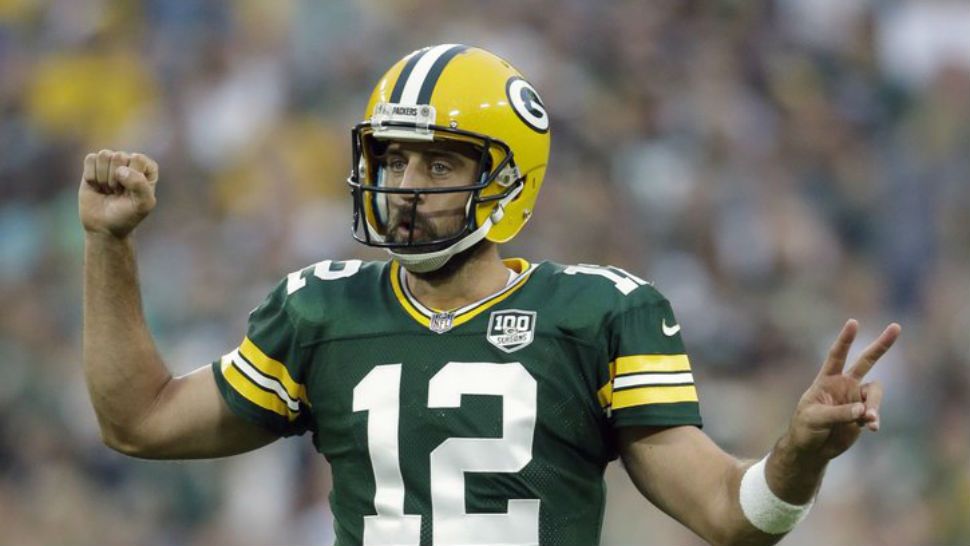 FILE - In this Aug. 16, 2018, file photo, Green Bay Packers’ Aaron Rodgers gestures during the first half of a preseason NFL football game against the Pittsburgh Steelers, in Green Bay, Wis. The Packers just need to keep Rodgers upright and healthy for a full season again. A glimpse at what life is like without Rodgers showed just how precious these windows of opportunity can be with a two-time NFL MVP at quarterback.(AP Photo/Jeffrey Phelps, File)