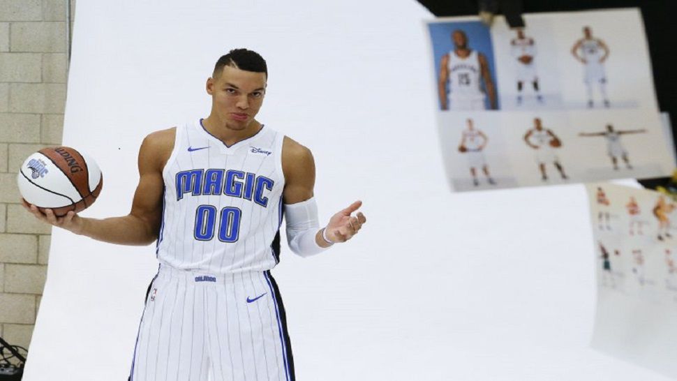 Orlando Magic’s Aaron Gordon poses for the team photographer during Orlando Magic NBA basketball media day, Monday, Sept. 25, 2017, in Orlando, Fla. (AP Photo/John Raoux)