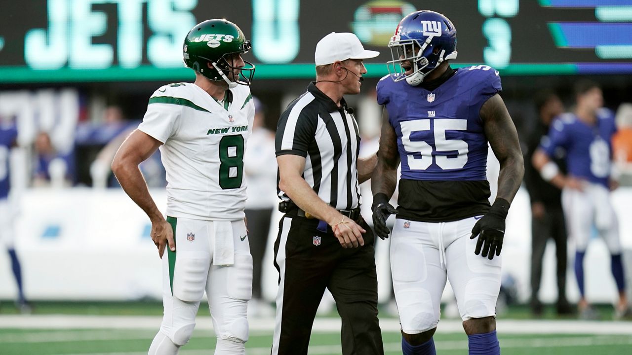 Aaron Rodgers and Jihad Ward talk during a game on Saturday, Aug. 26, 2023 in East Rutherford. (AP Photo/Vera Nieuwenhuis)