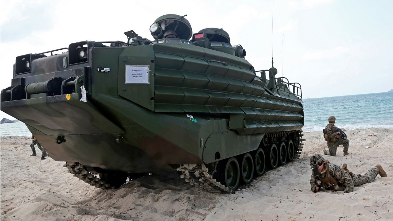 FILE - U.S. soldiers land with an amphibious assault vehicle (AAV) during a U.S.-Thai joint military exercise titled "Cobra Gold" on Hat Yao beach in Chonburi province, eastern Thailand, Saturday, Feb. 16, 2019. A training accident off the coast of Southern California in an AAV similar to this one has taken the life of one Marine, injured two others and left eight missing Thursday, July 30, 2020. In a Friday morning tweet, the Marines say the accident happened Thursday and search and rescue efforts are underway with support from the Navy and Coast Guard. (AP Photo/Sakchai Lalit)