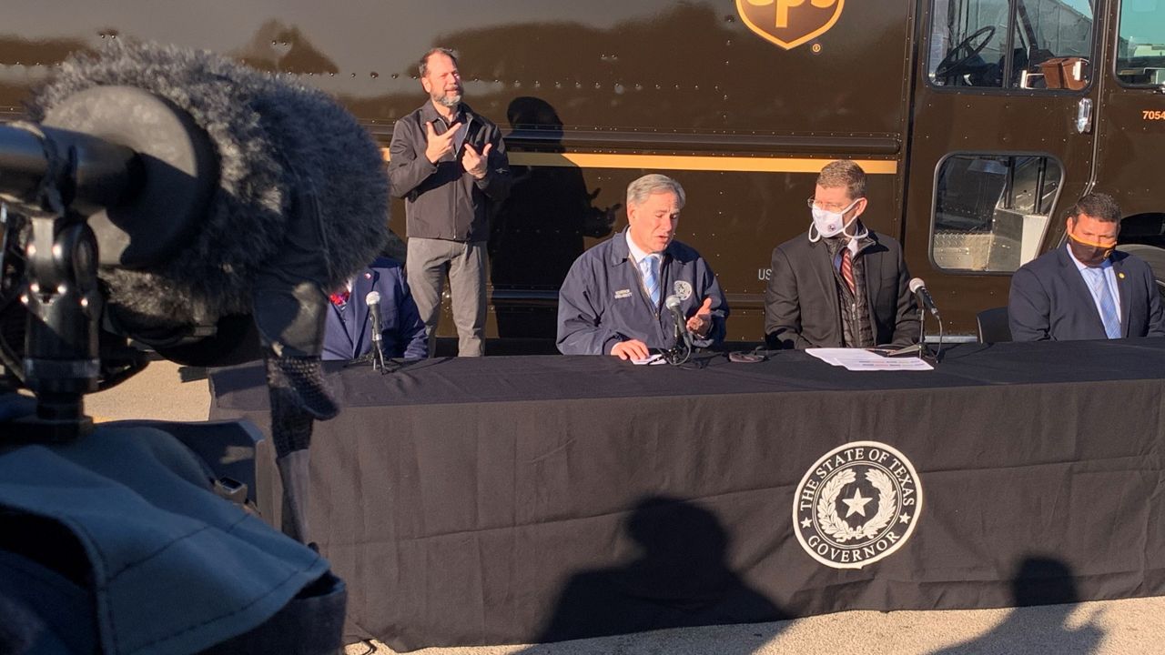 Texas Gov. Greg Abbott discusses COVID-19 vaccine distribution at the UPS Customer Center in Austin, Texas, in this image from December 17, 2020. (John Pope/Spectrum News 1)