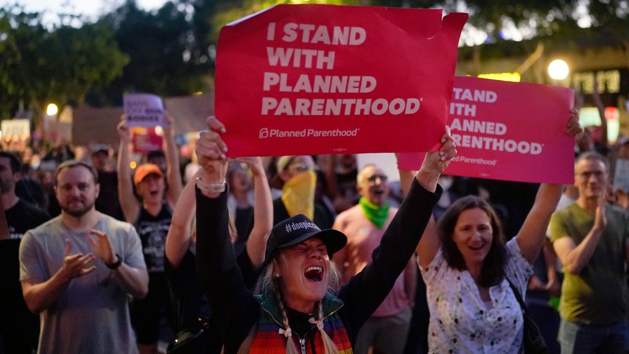 Supporters of abortion rights chant slogans outside a Planned Parenthood clinic during a protest in West Hollywood, Calif., on Friday. (AP Photo/Jae C. Hong)