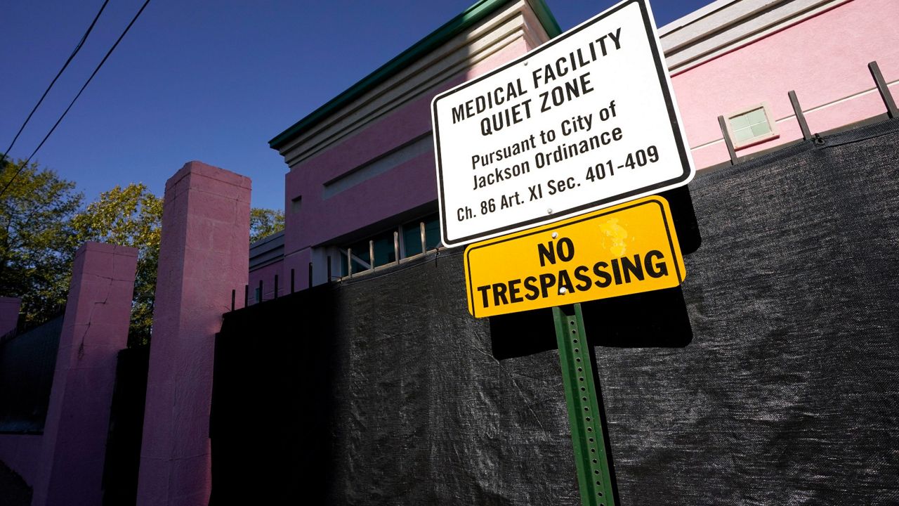 A sign indicating a "Medical Facility Quiet Zone" is displayed Nov. 18, 2020, outside the Jackson Women's Health Organization clinic in Jackson, Miss., the state's only state licensed abortion facility. (AP Photo/Rogelio V. Solis, File)