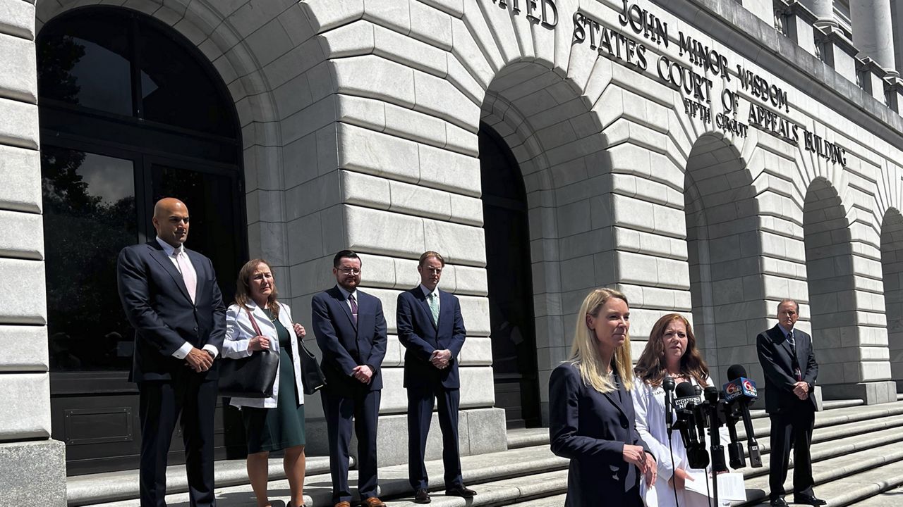 Erin Hawley, lead attorney for Alliance Defending Freedom, takes questions Wednesday from the media following a 5th Circuit Court of Appeals hearing in New Orleans. (AP Photo/Stephen Smith) 