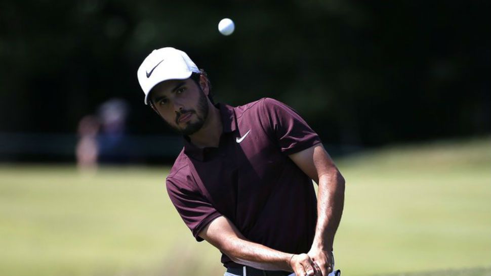 Abraham Ancer chips onto the second green during the third round of the Dell Technologies Championship golf tournament at TPC Boston in Norton, Mass., Sunday, Sept. 2, 2018. (AP Photo/Michael Dwyer)