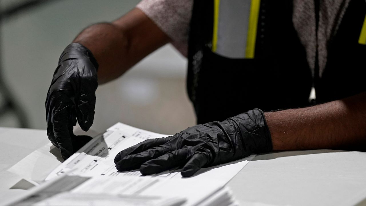 A worker prepares absentee ballots for mailing at the Wake County Board of Elections in Raleigh, N.C., Sept. 3, 2020. (AP Photo/Gerry Broome, File)