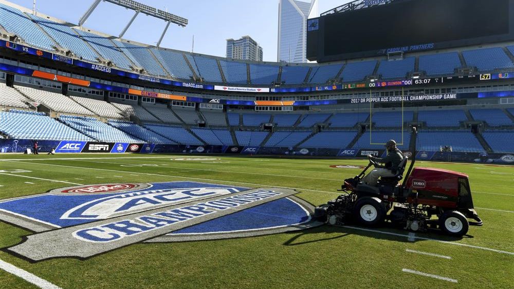 Crews prepare the field at Bank of America Stadium for the Atlantic Coast Conference championship NCAA college football game, Friday, Dec. 1, 2017. The Atlantic Coast Conference has wrapped up its spring meetings. Many discussions were held in private, including talks over how the league plans to close the financial gap with the Big Ten and the Southeastern Conference. (Diedra Laird//The Charlotte Observer via AP, File)