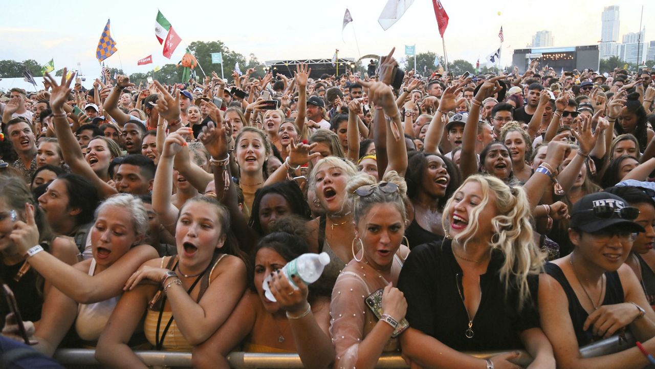 The crowd cheers as Nelly, not pictured, takes the stage on day two of the Austin City Limits Music Festival's first weekend on Saturday, Oct. 6, 2018, in Austin, Texas. (Photo by Jack Plunkett/Invision/AP)