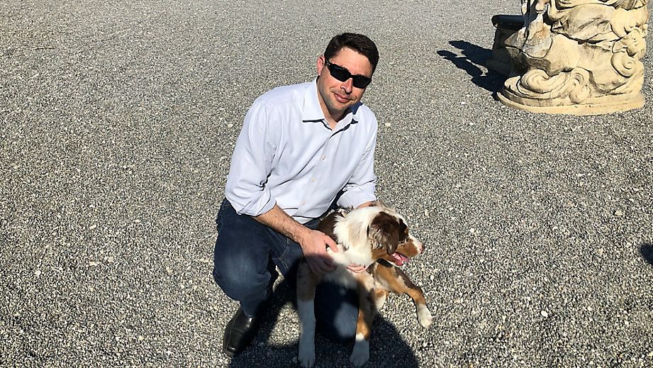 Adam Hattersley, with his dog Ike, in Brandon on Friday after announcing his candidacy for Florida CFO earlier in the week. (Spectrum Bay News 9/Mitch Perry)