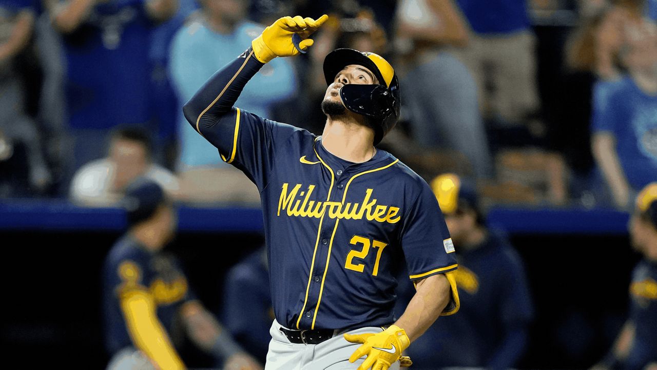 Milwaukee Brewers' Willy Adames celebrates as he crosses the plate 