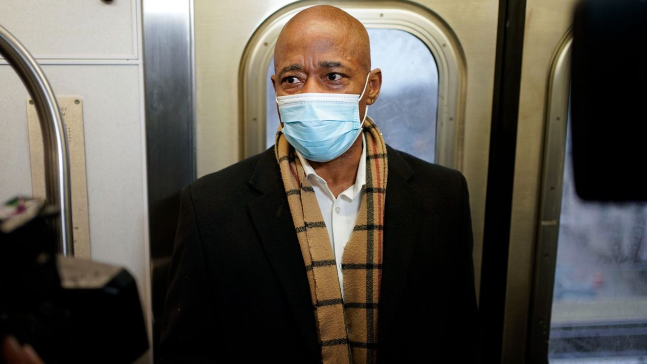Mayor Eric Adams rode the subway on the way to his office on the first day of his term, Jan. 1, 2022. (AP Photo/Seth Wenig)