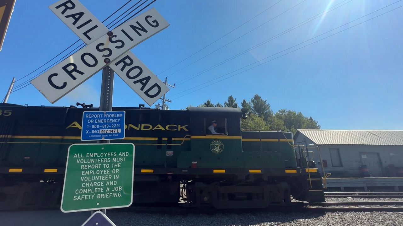 train at railroad crossing