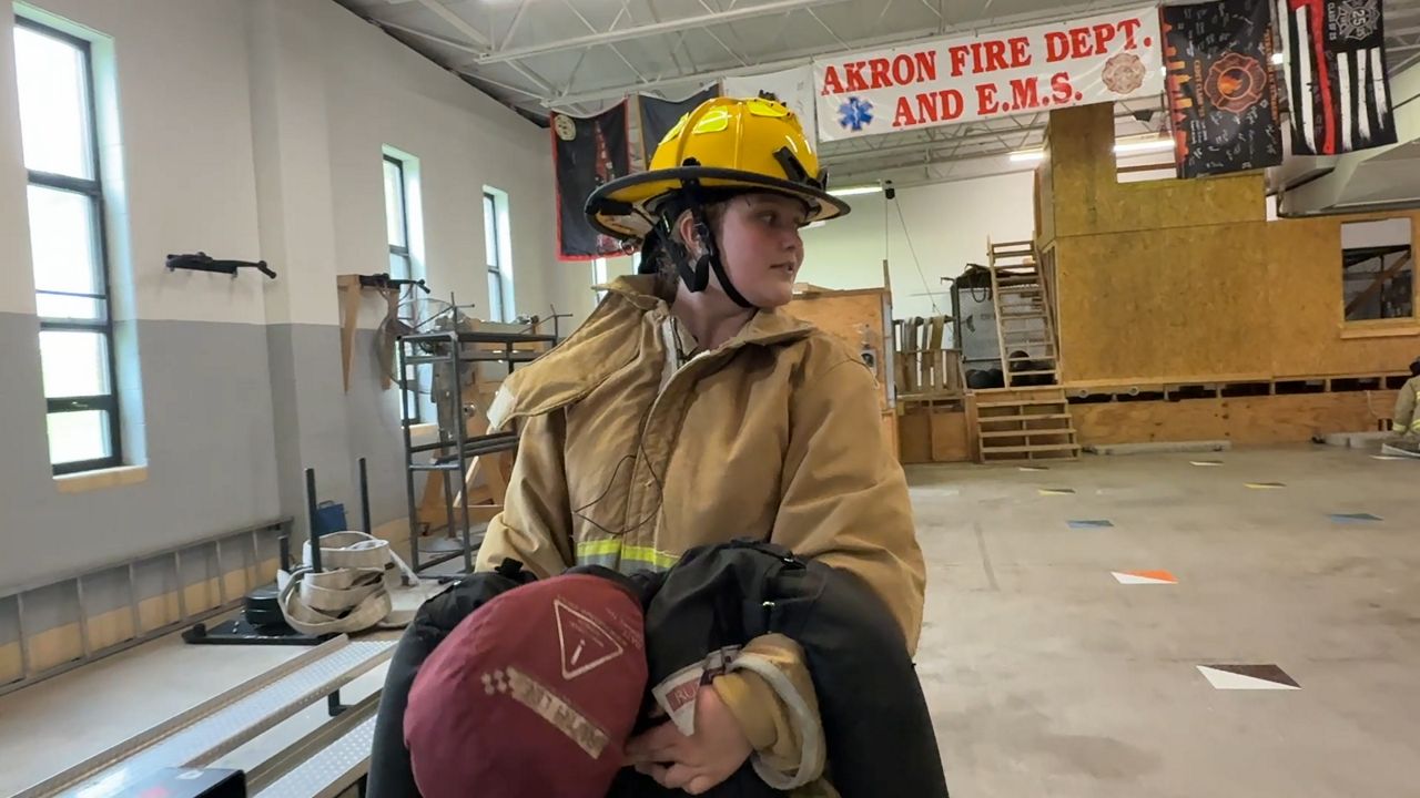 Alexis Wallace, a 10th grader at Ellet CLC participates in the mannequin drag at the Akron Fire Department training center. 