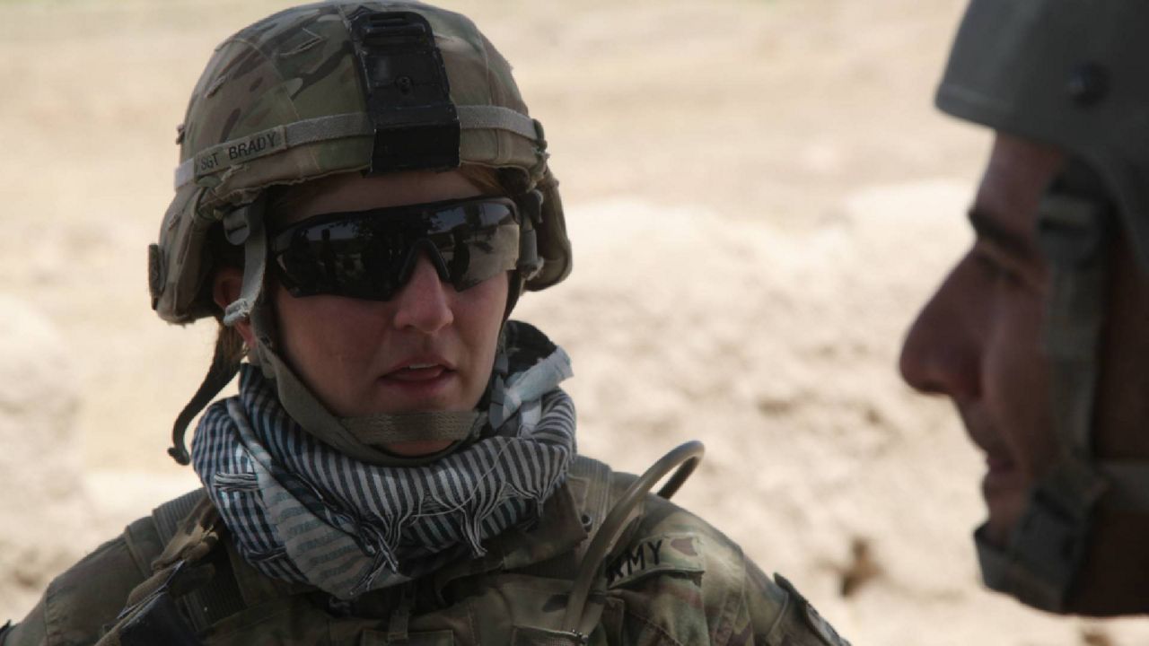 U.S. Army Sgt. Jodi Brady speaks with an interpreter in Ahmaday, Ghazni province, Afghanistan, July 7, 2012.