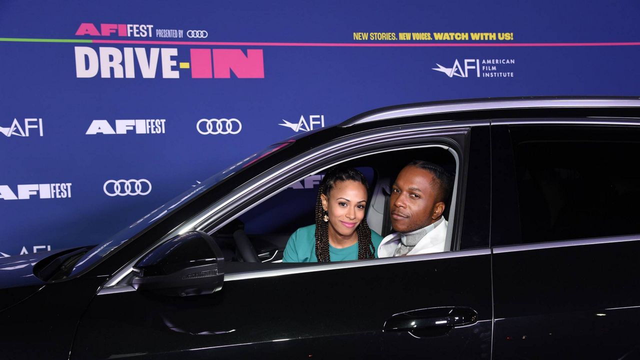 Nicolette Robinson and Leslie Odom Jr. attend AFI FEST's Centerpiece Drive-in screening of "One Night in Miami..." on Monday, Oct. 19, 2020 at the Rose Bowl in Pasadena, Calif. (Courtesy AFI FEST presented by Audi)