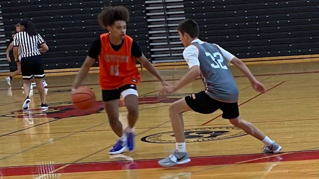 Aiden Assad playing basketball