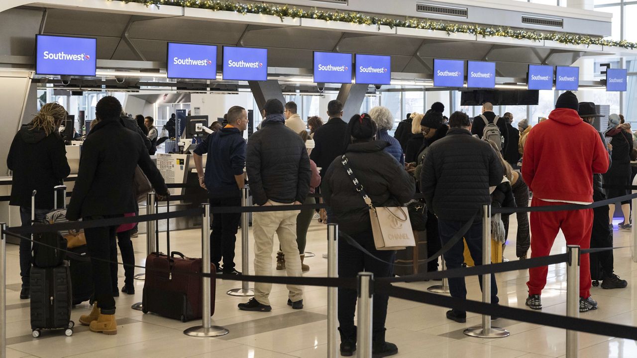 Cases of flu-like illnesses inch down as holiday travel season begins