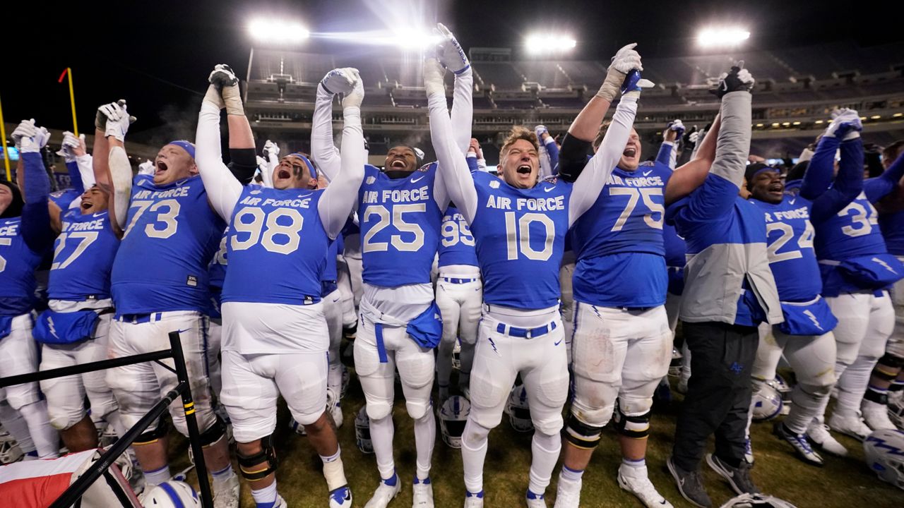 Air Force players raise their arms after a 30-15 win over Baylor in the Armed Forces Bowl NCAA college football game in Fort Worth, Texas, Thursday, Dec. 22, 2022. (AP Photo/LM Otero)