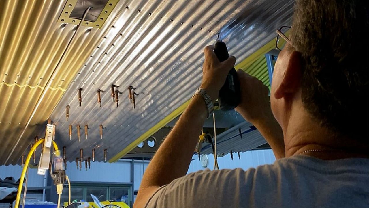 Foundation volunteers work to restore 1929 airplane