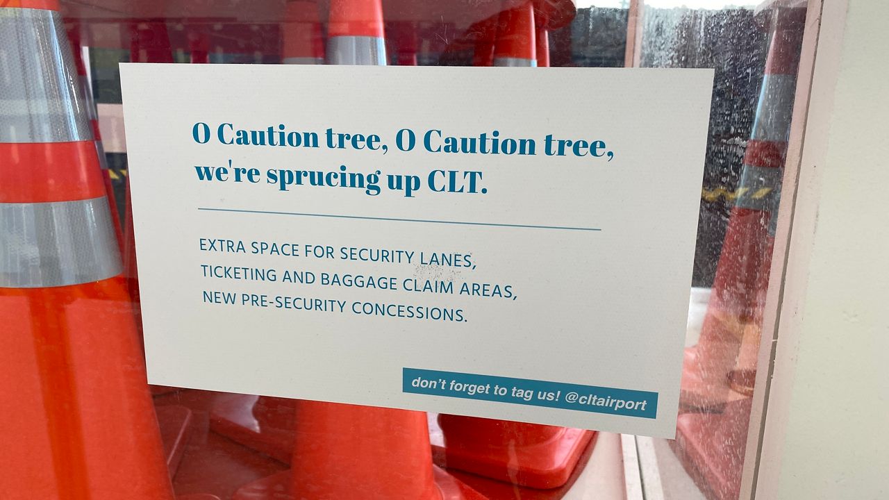 Sign warns passengers to be aware of construction. (Spectrum News 1)