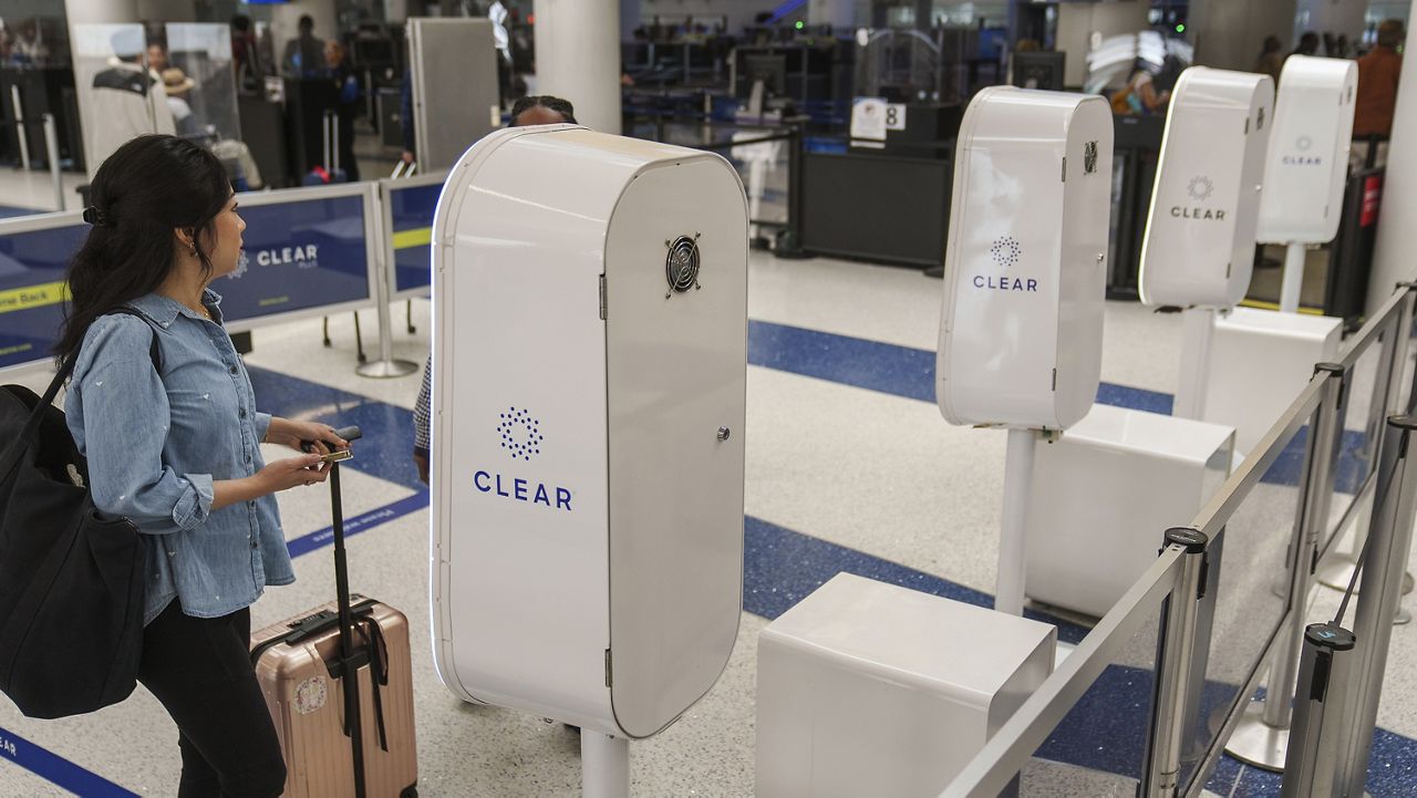 FILE - A traveler uses biometric check-in, to move faster through airport security at the departure area of the United Airlines terminal at Los Angeles International airport, Wednesday, June 28, 2023, in Los Angeles. (AP Photo/Damian Dovarganes)