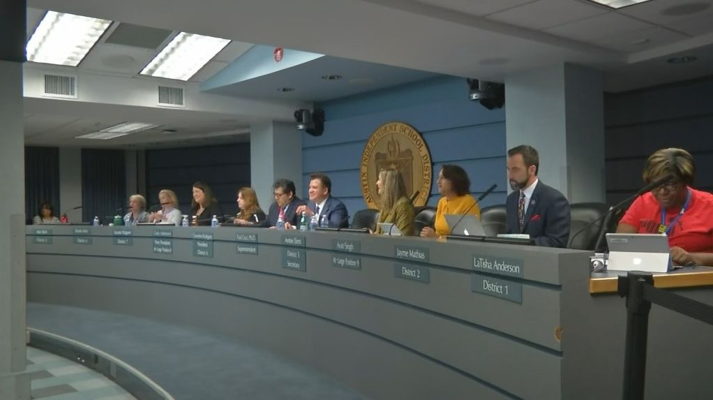 FILE - School board members seated as a meeting is underway. (Spectrum News)