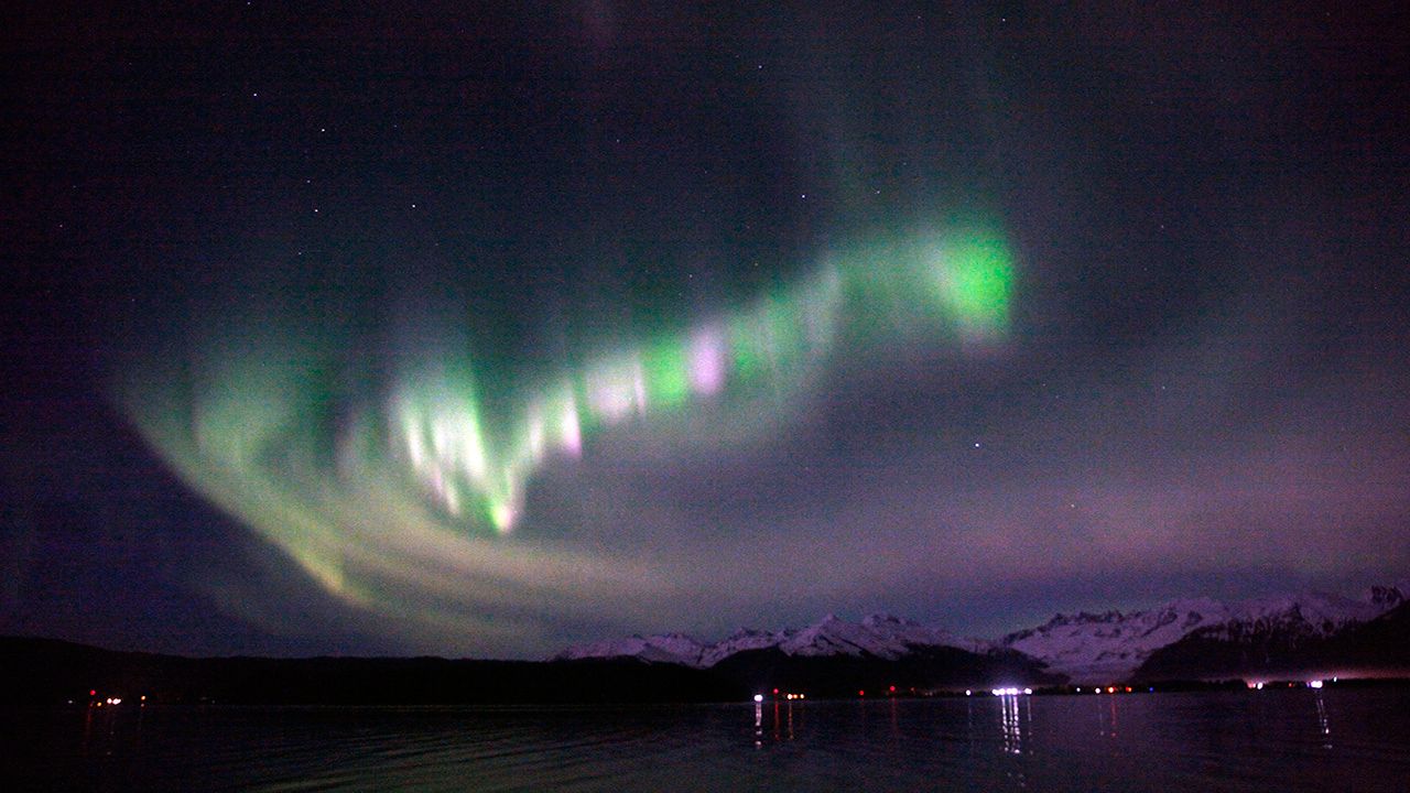 Northern Lights Over Mountains