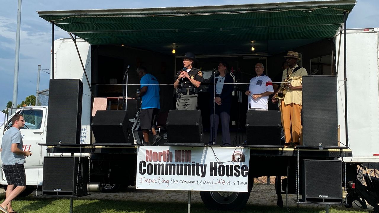 Summit County Sheriff Kandy Fatheree asked the crowd at Akron's National Night Out in North Hill to remember law enforcement officers are guardians, not warriors. 