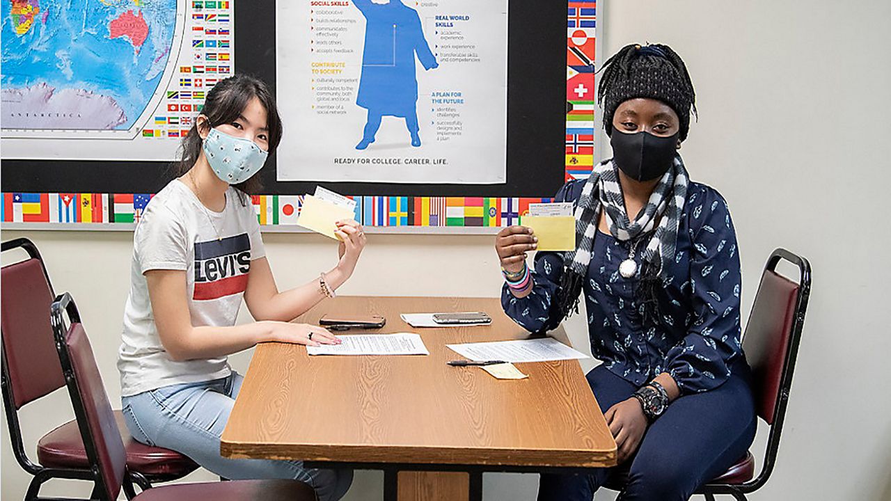 students show vaccine cards 