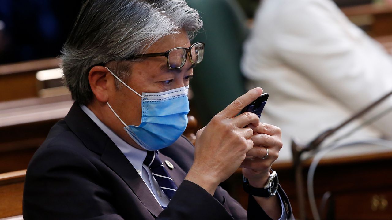 Assemblyman Al Muratsuchi, D-Torrance, looks at his phone as lawmakers debate the state budget bill, at the Capitol in Sacramento, Calif., Monday, June 15, 2020. The Assembly approved the spending plan and sent it to the Senate, but it will likely change as negotiations continue with Gov. Gavin Newsom on how to cover a $54.3 billion deficit. (AP Photo/Rich Pedroncelli)
