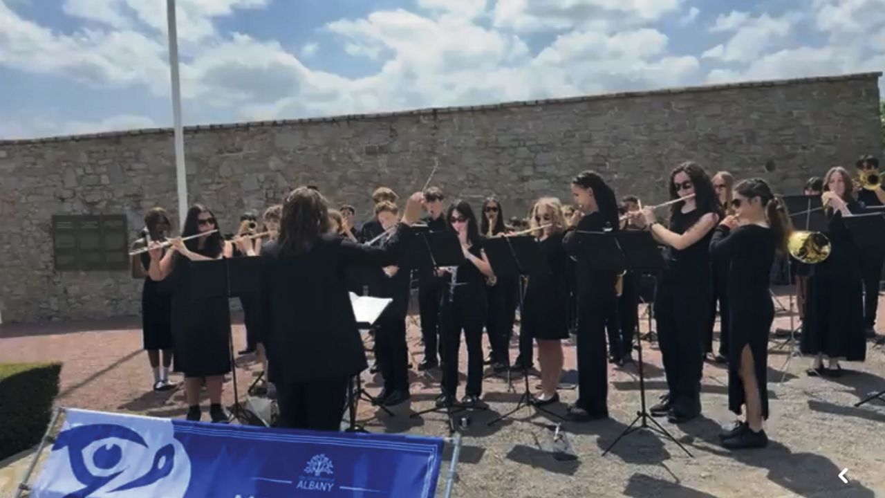 albany marching band performs in france