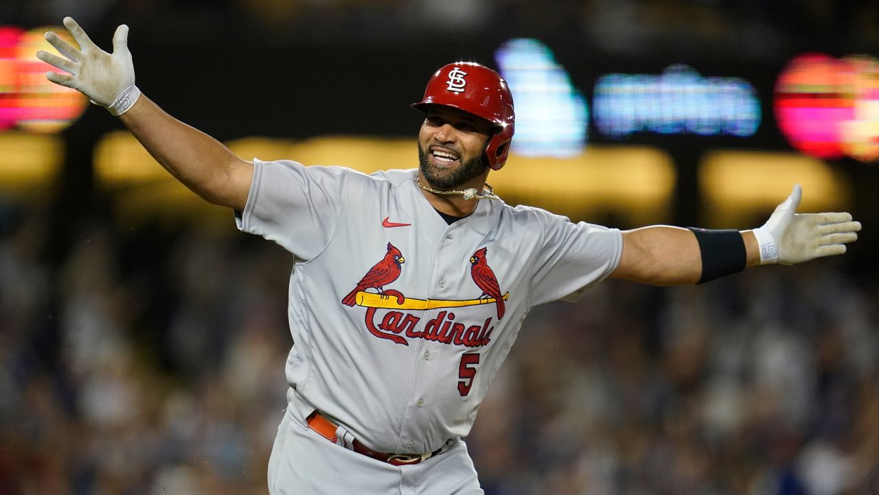 St. Louis Cardinals designated hitter Albert Pujols (5) reacts after hitting a home run during the fourth inning against the Los Angeles Dodgers in Los Angeles, Friday, Sept. 23, 2022. It was Pujols' 700th career home run. (AP Photo/Ashley Landis)