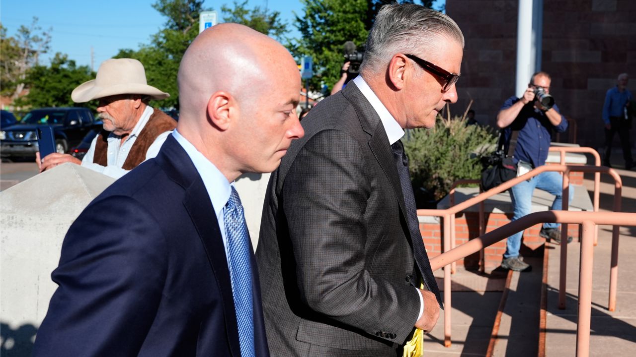 Actor Alec Baldwin, right, and attorney Luke Nikas, arrive for jury selection in his involuntary manslaughter trial on Tuesday in Santa Fe, N.M. (AP Photo/Ross D. Franklin)