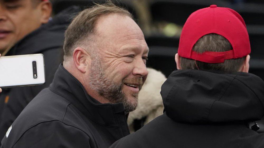 Alex Jones, left, attends a rally in support of President Donald Trump called the "Save America Rally," Wednesday, Jan. 6, 2021, in Washington. (AP Photo/Jacquelyn Martin, File)