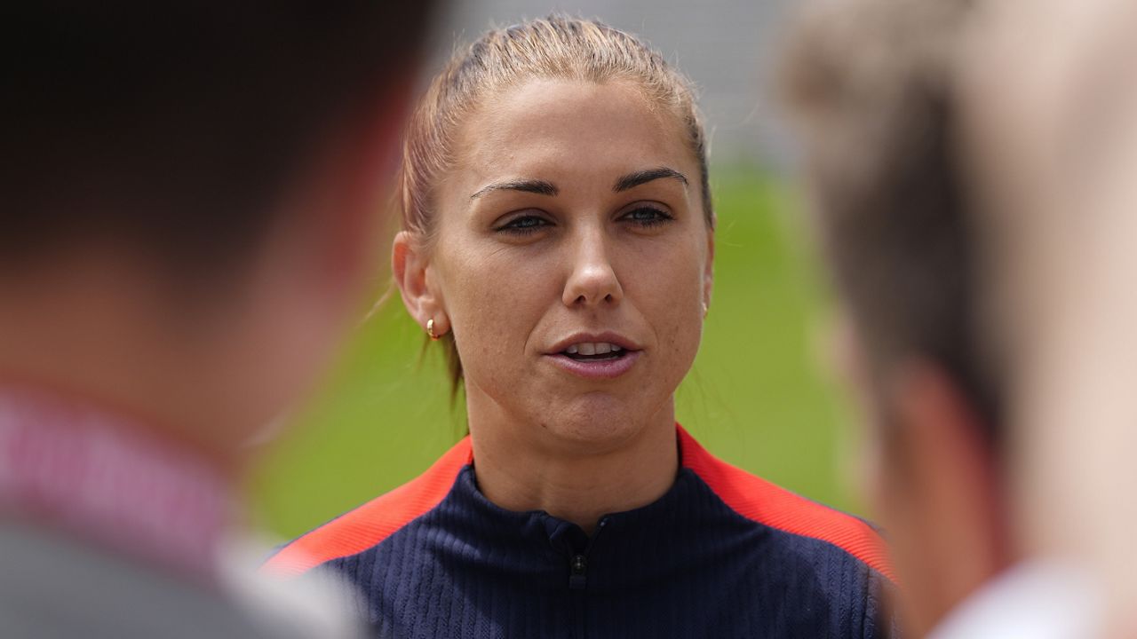 United States national women's soccer team player Alex Morgan talks to reporters before a practice to prepare for a friendly match against South Korea, Friday, May 31, 2024, in Commerce City, Colo. (AP Photo/David Zalubowski, File)